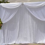 Platinum Backdrop with Crystal Curtains and Flowers by SBD Events and SBD Event Designs
